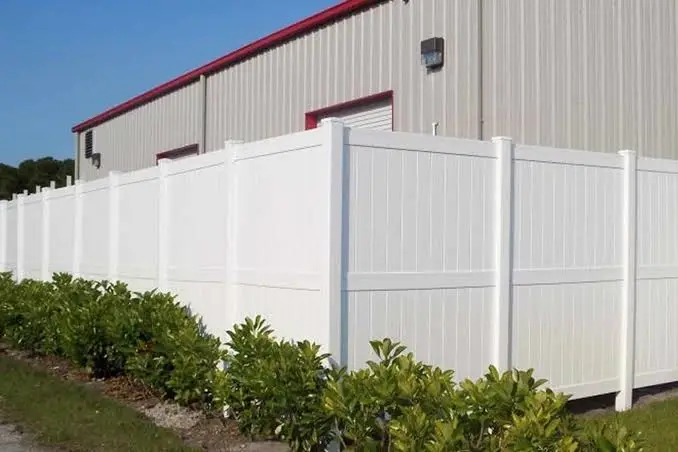 Vinyl screening panels around a commercial enclosure