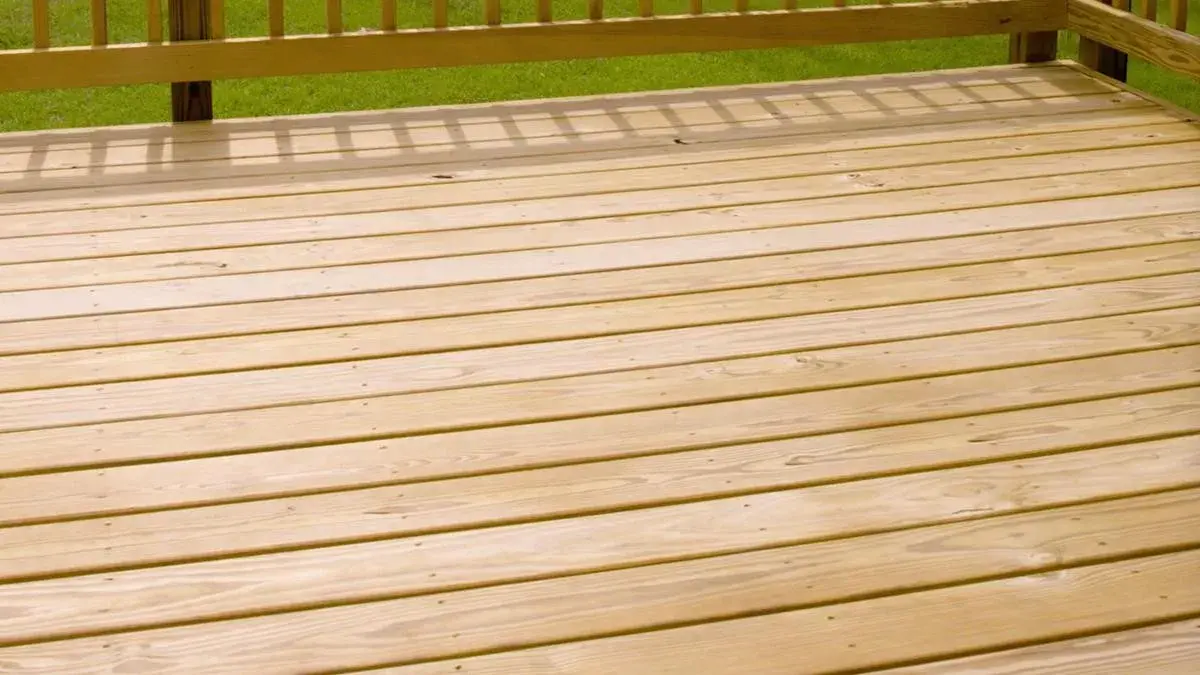 New pressure-treated wood deck with stairs